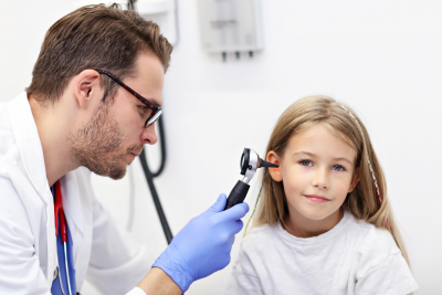 doctor checking a girls ear